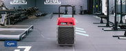 AlorAir Storm 80X commercial dehumidifier operating in a gym facility to control humidity around fitness equipment