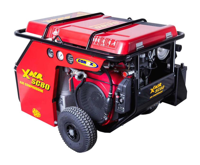 Red Con X Air SC80 80 CFM portable air compressor with Honda engine, protective frame, wheels, and control panel visible.