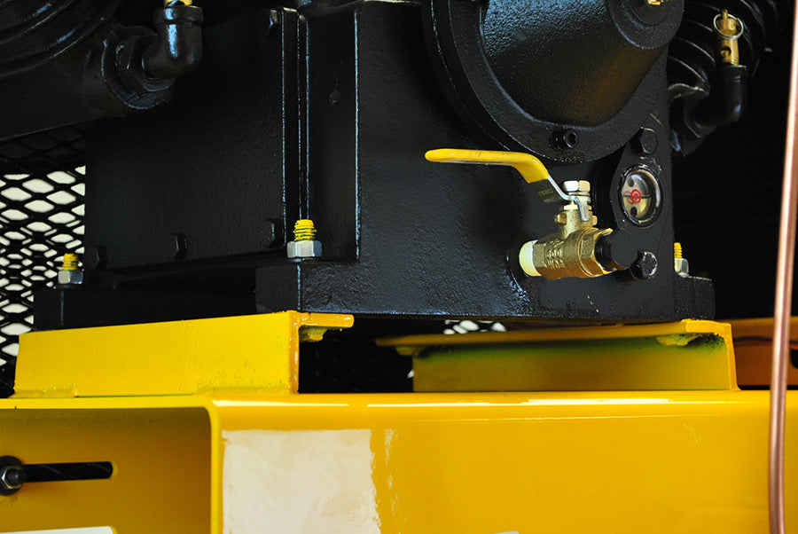 Close-up of the brass valve and pressure release on the pump of the EMAX E450-GR 20 Gallon Wheelbarrow Air Compressor