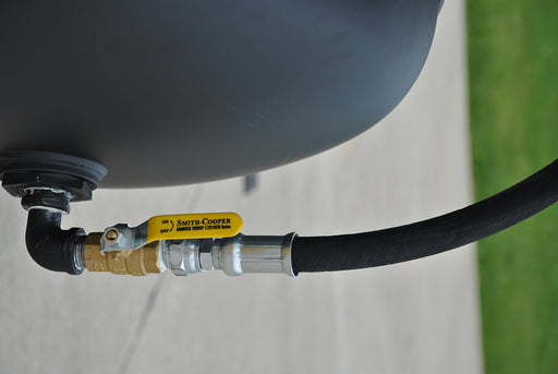 Close-up view of the Smith-Cooper valve and hose connection on the EMAX E4500 Series rotary screw air compressor.