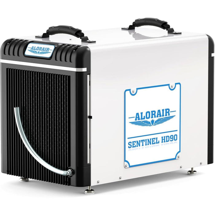 Side angle view of the AlorAir Sentinel HDi90 dehumidifier showing coil ventilation and drain hose connection