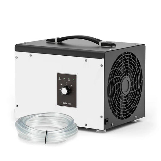 AlorAir Sentinel HS35 crawl space dehumidifier
shown at a front angle with its control knob, carrying
handle, and coiled gravity drain hose in front