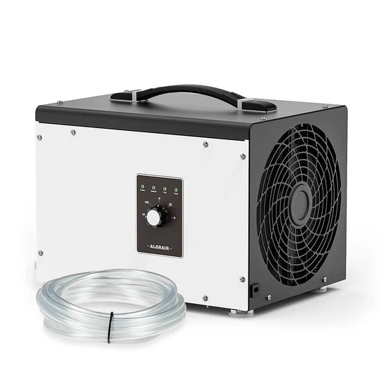 AlorAir Sentinel HS35 crawl space dehumidifier
shown at a front angle with its control knob, carrying
handle, and coiled gravity drain hose in front