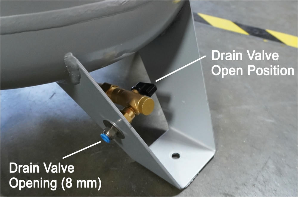 Close-up of drain valve in open position on California Air Tools oil-free air compressor steel tank