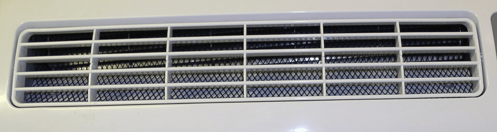 Close-up of EBac AD850E dehumidifier air outlet grille showing internal filter and airflow channel design