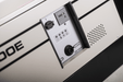 Close-up of EBac CD100E dehumidifier control panel with humidistat dial, status lights, and alarm port