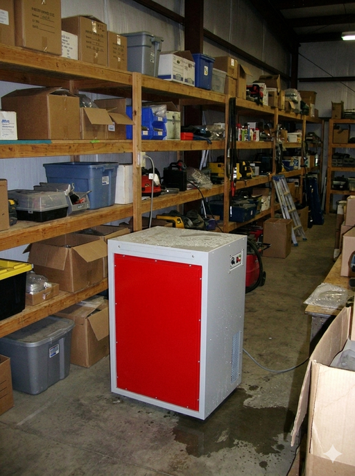 EBac Freestar commercial industrial dehumidifier installed in warehouse setting with shelving and equipment