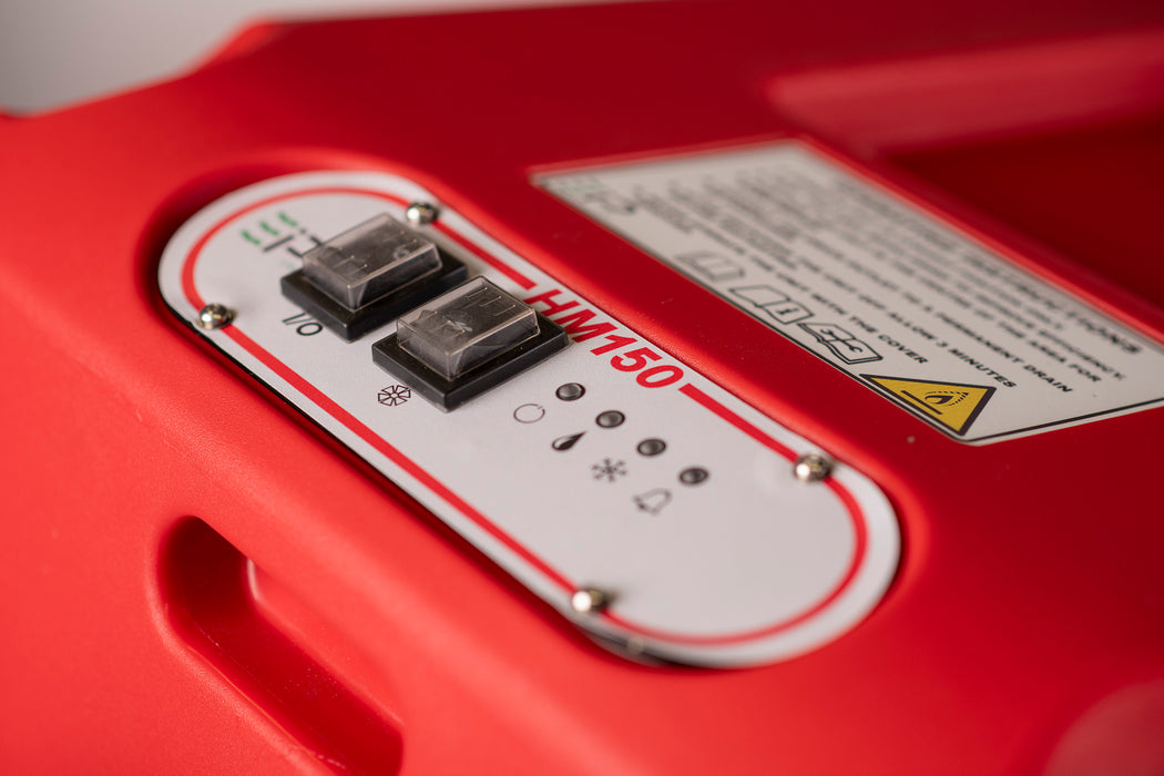 Top panel detail of EBac HM150 showing power switches, status indicator lights, and warning label.