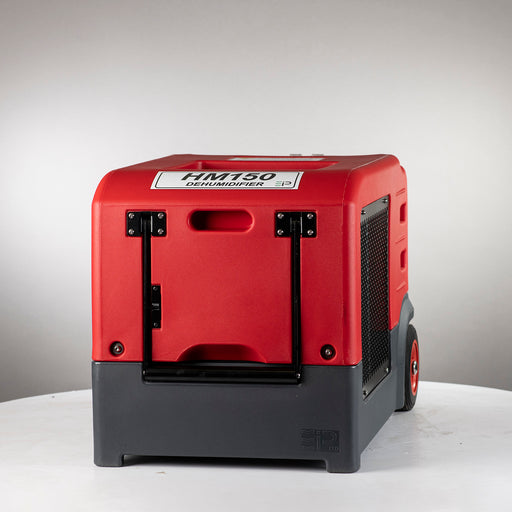 Front view of EBac HM150 industrial dehumidifier showing red rotomolded housing and integrated carry handle.