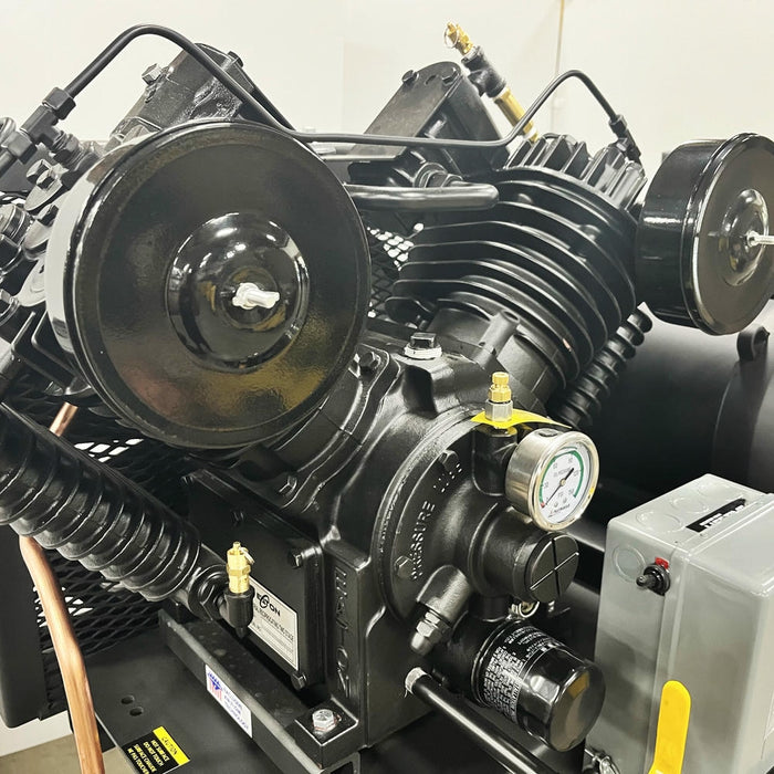 Close-up of pressure-lubricated piston pump assembly on EMAX E450-D duplex industrial air compressor