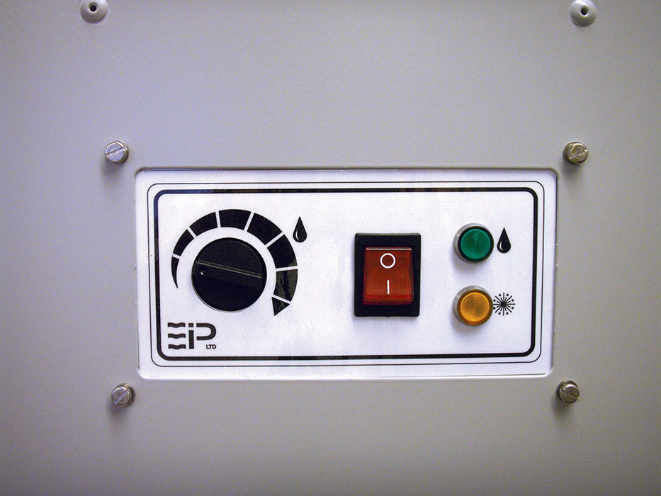 Close-up of EBac Freestar dehumidifier control panel showing humidistat dial, power switch, and status indicator lights