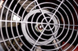 Front fan grill and internal blades of a high velocity industrial air mover