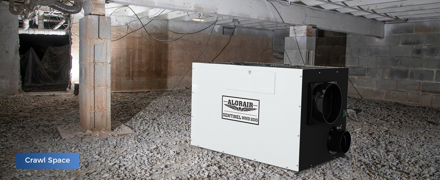 AlorAir Sentinel WHD200 whole house dehumidifier installed on a gravel crawl space floor