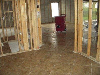 Novatek Novair 1000 Air Scrubber in operation at a construction site, providing air filtration and maintaining negative air pressure in the workspace